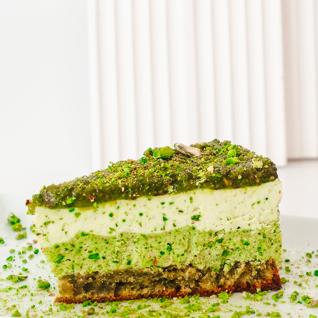 delicious raw cake with pistachios and pili nut cream