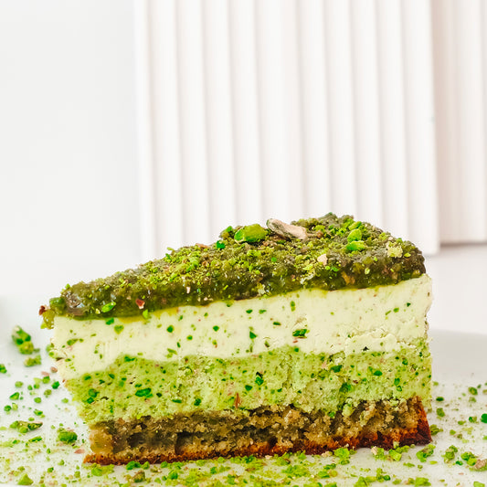 delicious raw cake with pistachios and pili nut cream